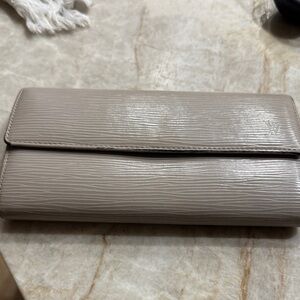 Louis Vuitton epi leather wallet in taupe.